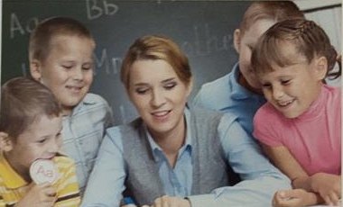 Teacher with young children in a classroom